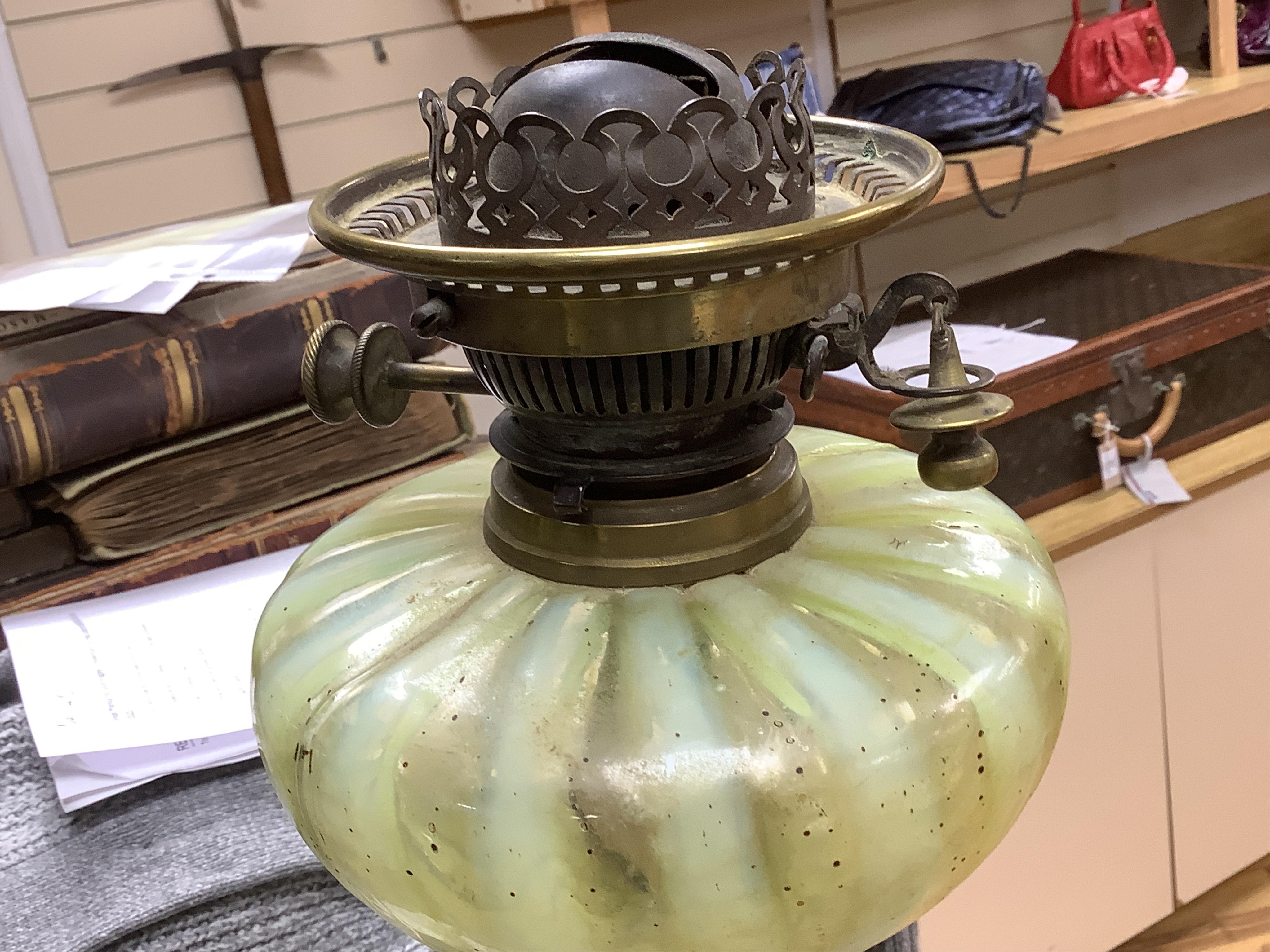 An Edwardian vaseline glass and brass oil lamp and shade, 56cm high